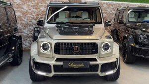 METALIC GOLD EXTERIOR COLOR WITH EHITE AND BROWN LEATHER FULLY CARBON