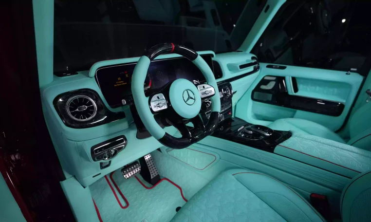 G7X Onyx Concept 1 of 5 Hyacinth Red Metallic Luxury Car Showroom